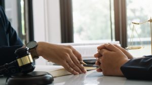 Lawyers talking at a desk