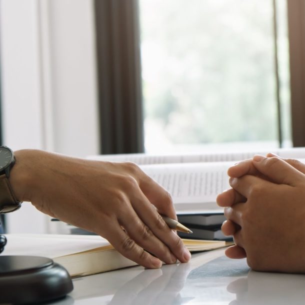 Lawyers talking at a desk