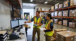 A warehouse manager assists an employee returning to work after an injury, describing her new light duty work responsibilities.